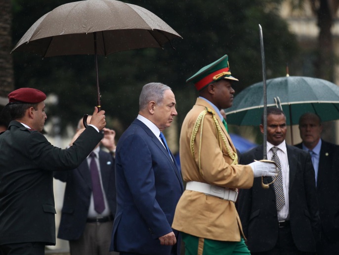 Israeli Prime Minister Benjamin Netanyahu walks to inspect a guard of honor at the National Palace during his State visit to Addis Ababa, Ethiopia, July 7, 2016. REUTERS/Tiksa Negeri