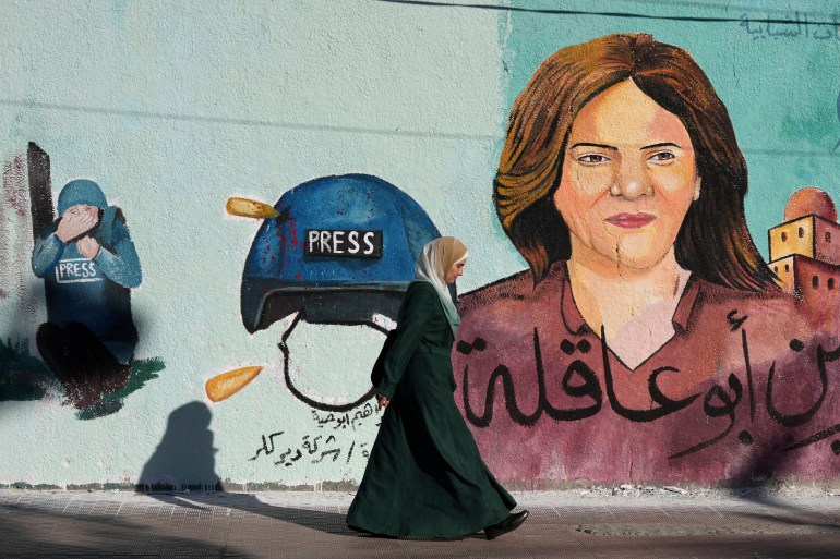 A mural of slain of Al Jazeera journalist Shireen Abu Akleh adorns a wall, in Gaza City, Sunday, May 15, 2022. Abu Akleh was shot and killed while covering an Israeli raid in the occupied West Bank town of Jenin on May 11, 2022. (AP Photo/Adel Hana)