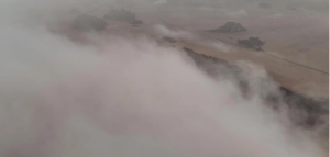 الغيوم تعانق قمم “بجده” والأمطار تُزين صحراءها الشاسعة