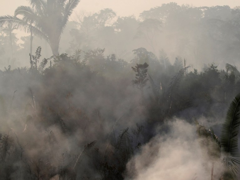 Smoke billows during a fire in an area of the Amazon rainforest near Humaita, Amazonas State, Brazil, Brazil August 14, 2019. Picture Taken August 14, 2019. REUTERS/Ueslei Marcelino