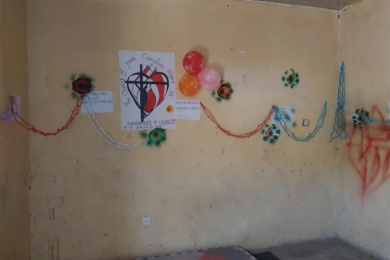 At the HAL Centre in Bora, art made by female survivors of violence is displayed on a wall [Gelila Getahun/Al Jazeera]