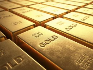 الذهب يتراجع عن مستوياته القياسية بعد تلميحات رئيس الاحتياطي الفيدرالي بخفض أسعار الفائدة