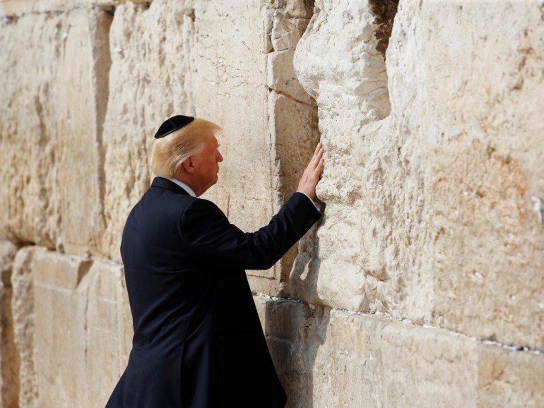 U.S. President Donald Trump touches the Western Wall, Judaism's holiest prayer site, in Jerusalem's Old City May 22, 2017. REUTERS/Ronen Zvulun