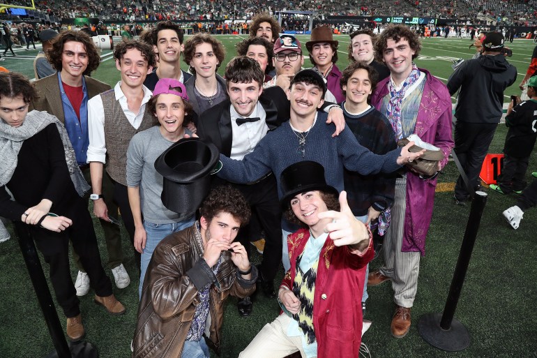 EAST RUTHERFORD, NEW JERSEY - OCTOBER 31: Timothée Chalamet look-alikes appear on the sideline during the Houston Texans vs. New York Jets Thursday Night Football game at MetLife Stadium on October 31, 2024 in East Rutherford, New Jersey. (Photo by Al Pereira/Getty Images)