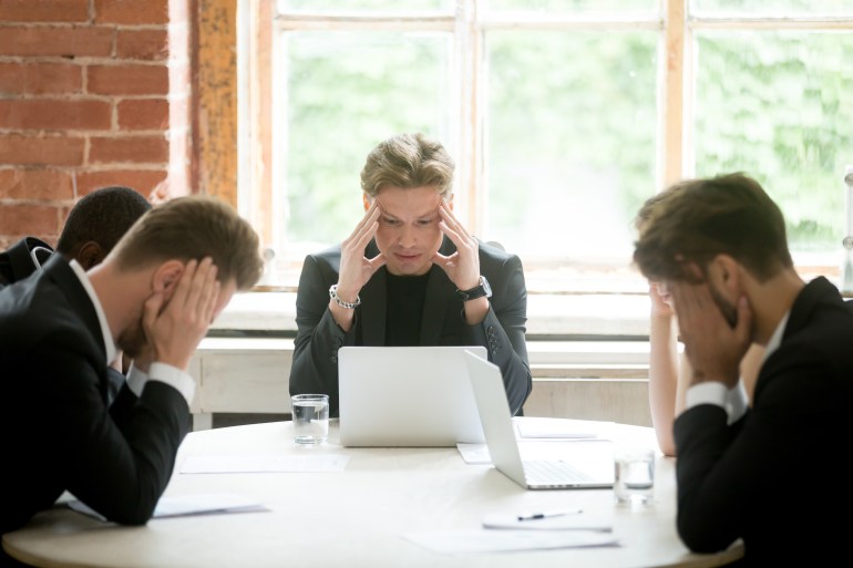 793409209 Stressed boss and executive team searching problem solution at meeting, partners holding heads in hands depressed by failure bad news, feeling desperate about company bankruptcy or financial crisis Keywords ShutterStock, Shutter Stock, online thinking, problem professional, collapse company, result sad, investor job, work worker, boss business, stock stress, data deadline, anxious bad, distraught downfall, unhappy upset, bankruptcy board, businessmen career, crash crisis, meltdown mistake, bank bankrupt, fall finance, nervous office, marketing meeting, hard hopeless, disappointed dismay, manager market, debt decreased, important investment, frustration group, stressful suit, loser loss, fail failure, economic employee, tension trouble, sales serious, laptop leadership, despair desperate, profit recession, team teamwork, solution solving, lost male, entrepreneur executive, worried young, ceo challenge, depression desk, panic people, concept corporate, person pressure, money negative, difficult directors, financial frustrated, man management